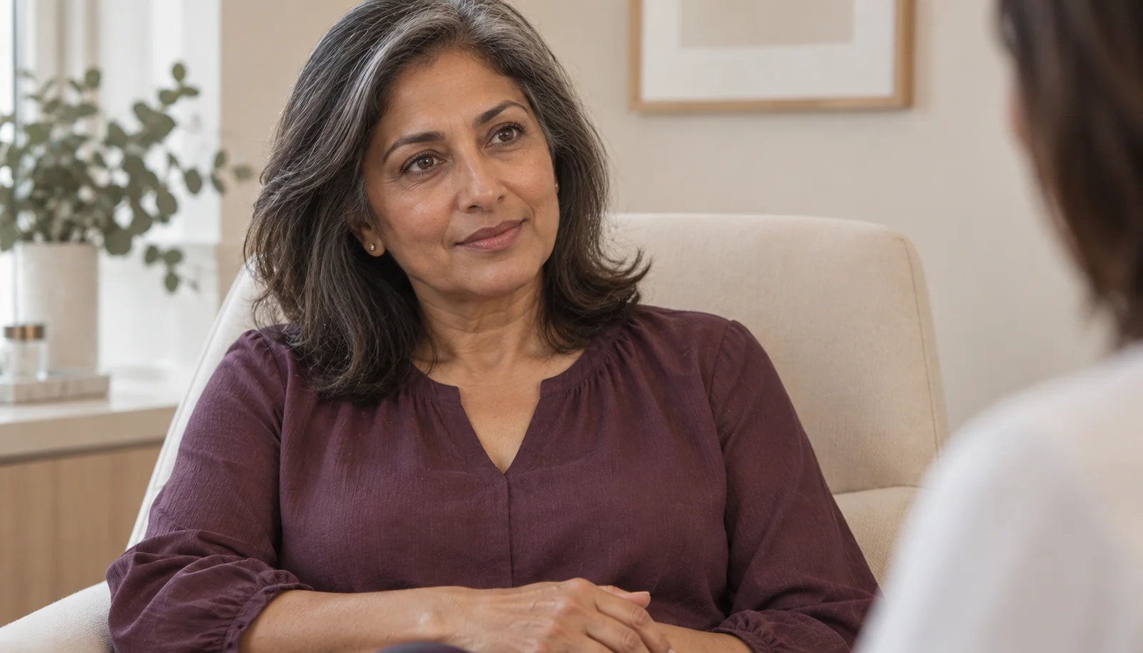 Woman considering cosmetic tattooing during a consultation