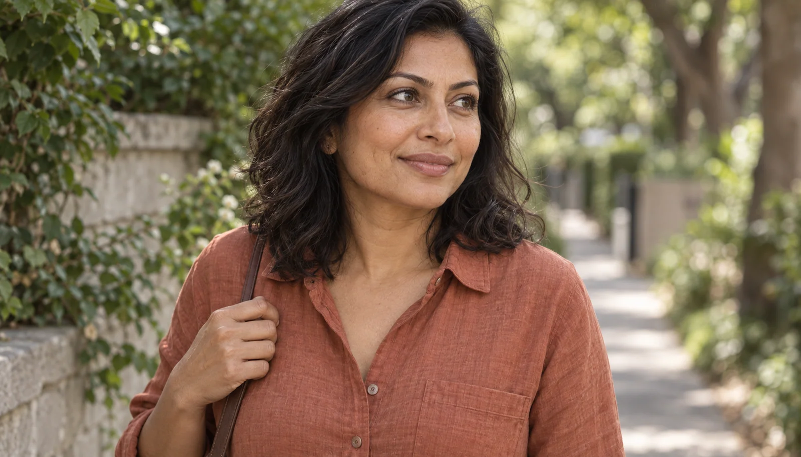 Woman enjoying a quiet walk with natural lash definition