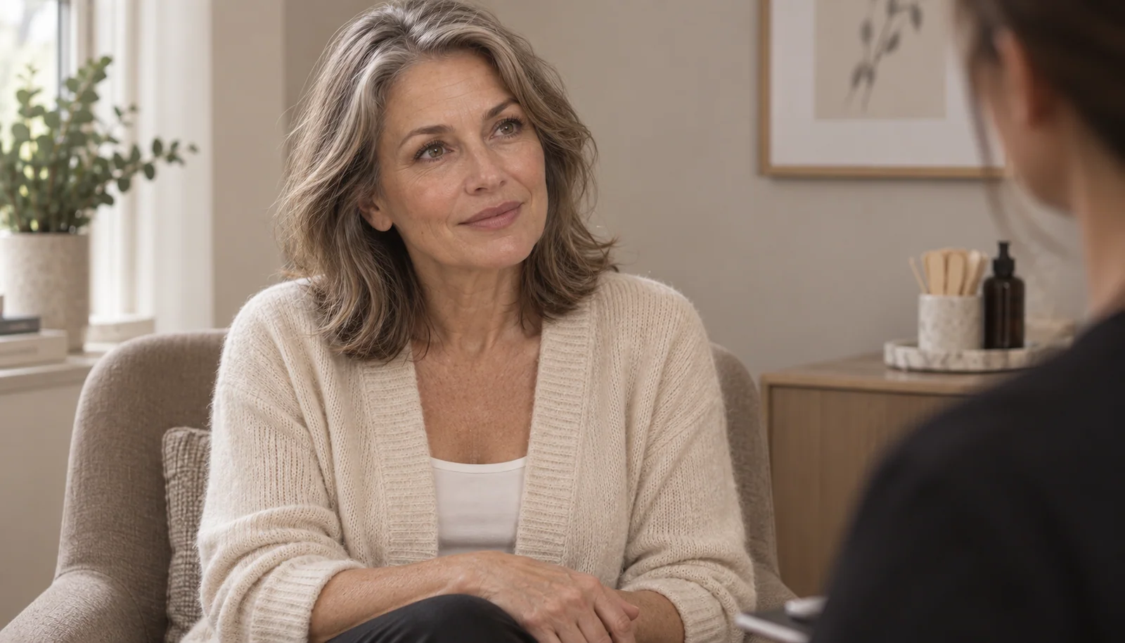 Woman listening thoughtfully at a consultation